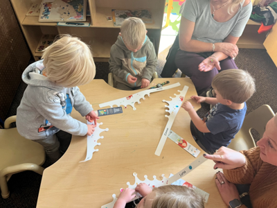 Students working on a hands-on bookmaking activity